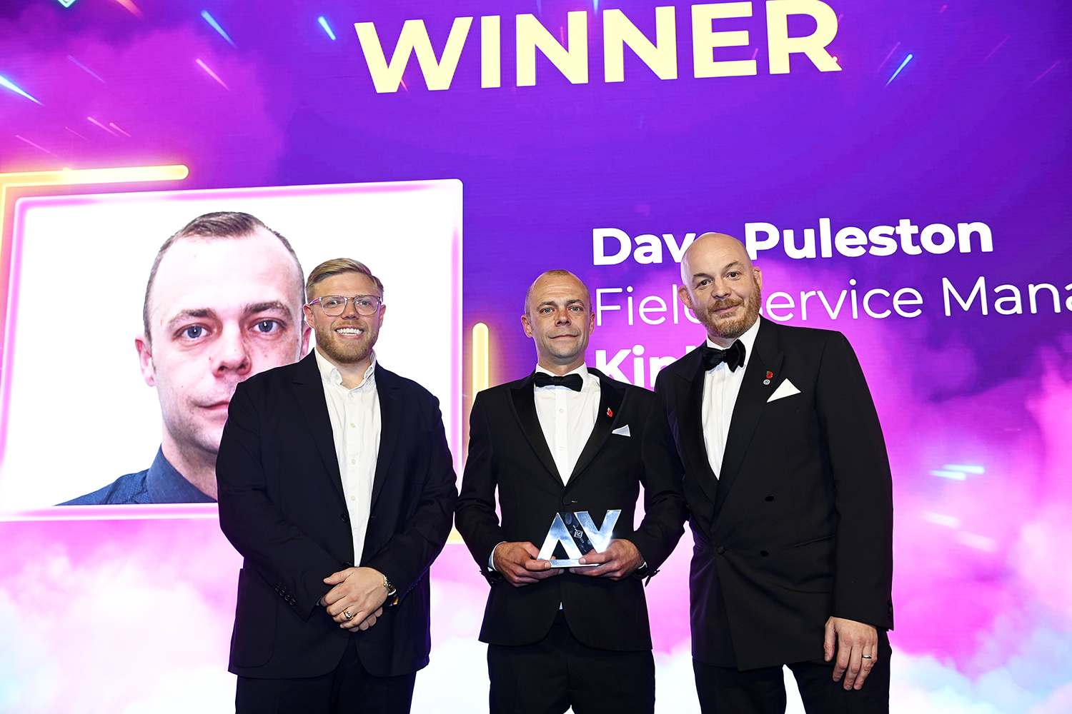 Dave Puleston posing with his award at the AV Awards